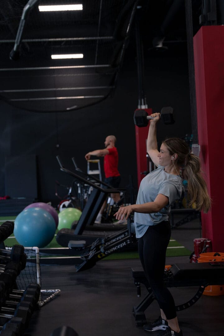 Woman lifting dumbbell at Speed Mechanics